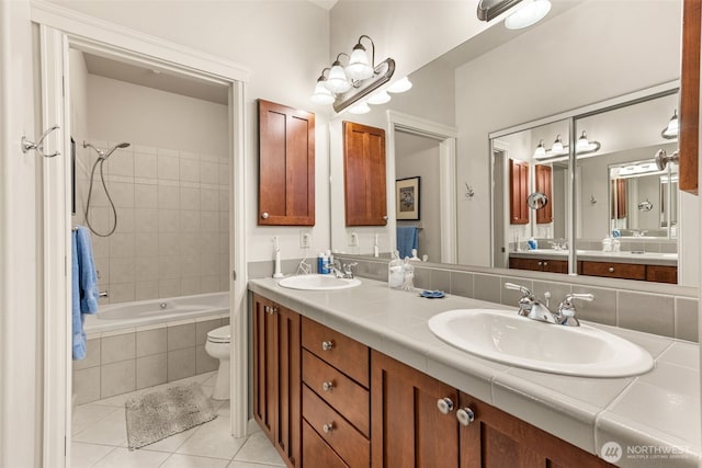 2440 S Steele St Unit 103, Tacoma, WA 98405 - bathroom featuring tile patterned flooring, double vanity, and tiled shower / bath