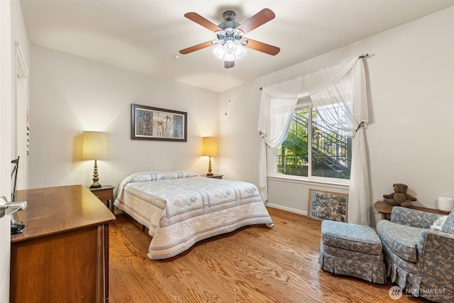 2440 S Steele St Unit 103, Tacoma, WA 98405 - bedroom with light wood finished floors and a ceiling fan