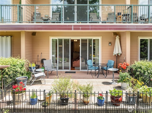 2440 S Steele St Unit 103, Tacoma, WA 98405 - back of house with a patio area and a balcony