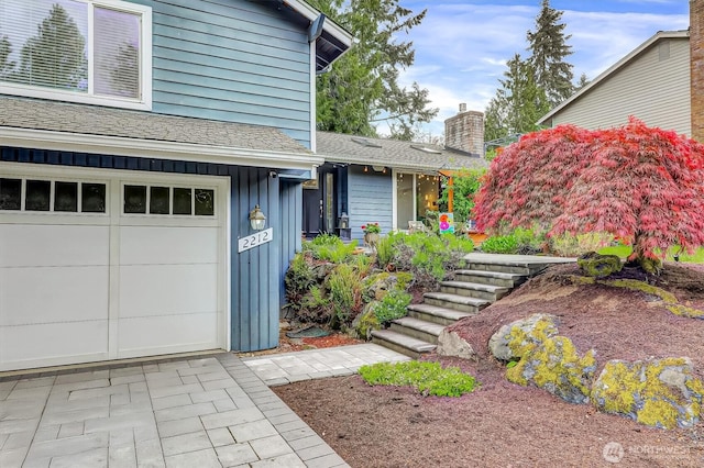 2212 186th Ave NE, Redmond, WA 98052 - entrance to property featuring board and batten siding and a chimney