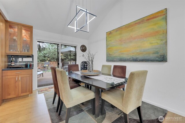 2212 186th Ave NE, Redmond, WA 98052 - dining space featuring light wood-style flooring and high vaulted ceiling
