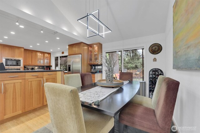 2212 186th Ave NE, Redmond, WA 98052 - dining room featuring light wood-style floors, recessed lighting, and high vaulted ceiling