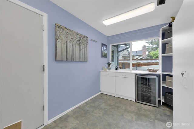 2212 186th Ave NE, Redmond, WA 98052 - bar featuring wine cooler and baseboards