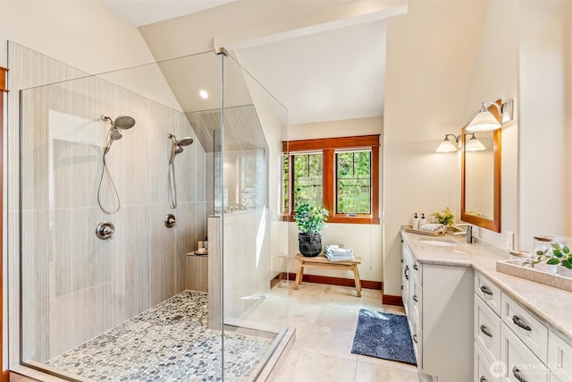6117 39th Dr NW, Marysville, WA 98271 - bathroom featuring vanity, walk in shower, vaulted ceiling, and tile patterned floors