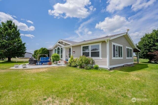 1448 Rd C NE, Moses Lake, WA 98837 - rear view of property featuring a patio and a yard