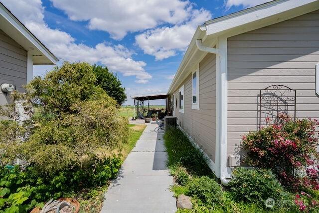 1448 Rd C NE, Moses Lake, WA 98837 - view of side of home featuring a cooling unit