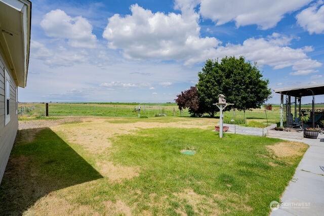 1448 Rd C NE, Moses Lake, WA 98837 - view of grassy yard featuring a vegetable garden