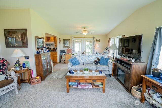 1448 Rd C NE, Moses Lake, WA 98837 - living room featuring light colored carpet, lofted ceiling, and ceiling fan