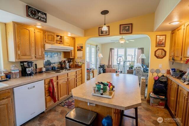 1448 Rd C NE, Moses Lake, WA 98837 - kitchen with white appliances, arched walkways, under cabinet range hood, and light countertops