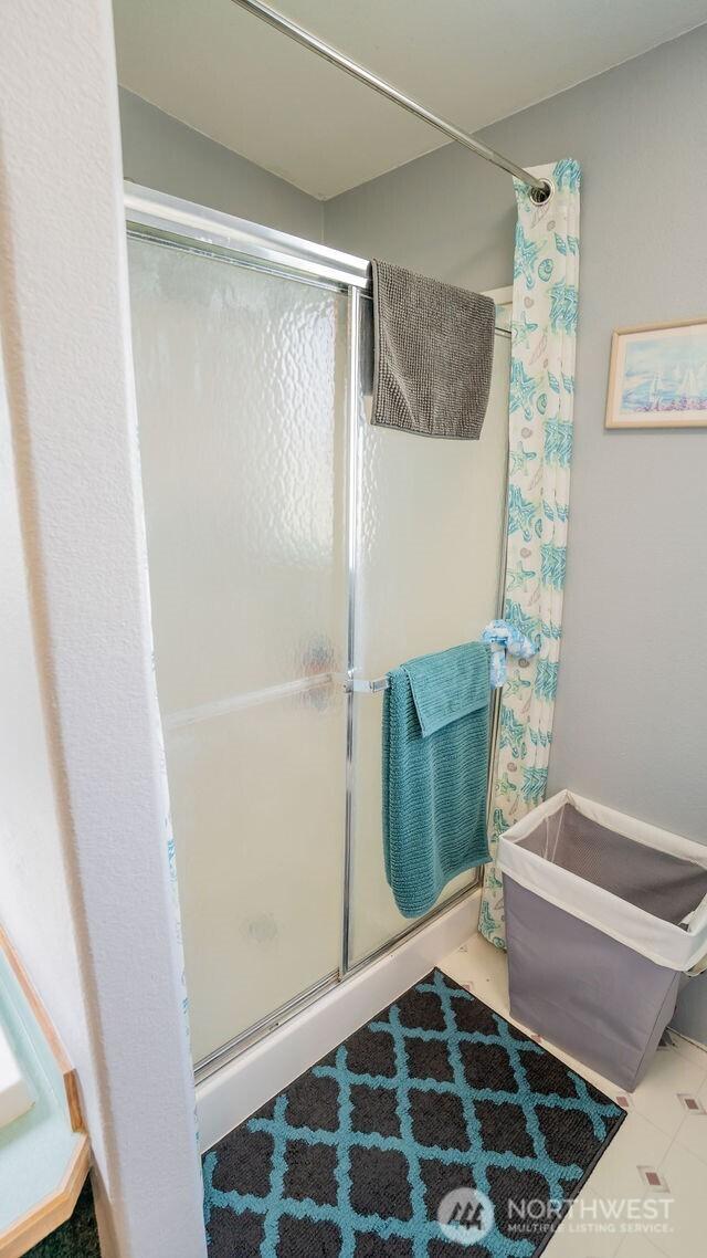 1448 Rd C NE, Moses Lake, WA 98837 - bathroom with a shower stall and tile patterned flooring