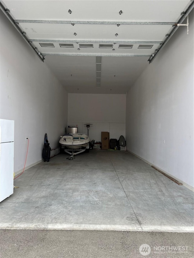 9532 NW Ridgeview Dr Unit 36, Quincy, WA 98848 - garage with freestanding refrigerator