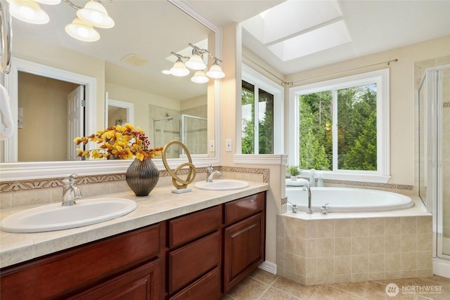 24826 SE 22nd Ct, Sammamish, WA 98075 - bathroom featuring a stall shower, double vanity, a bath, tile patterned floors, and a skylight