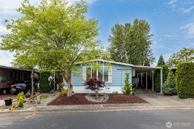 2725 E Fir Unit 74, Mount Vernon, WA 98273 - manufactured / mobile home with a carport and concrete driveway
