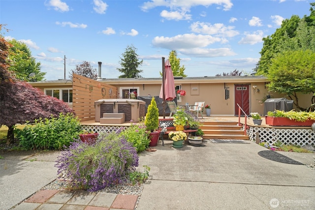 6338 Kirsop, Olympia, WA 98512 - ranch-style home featuring a deck, stucco siding, a patio area, and a hot tub