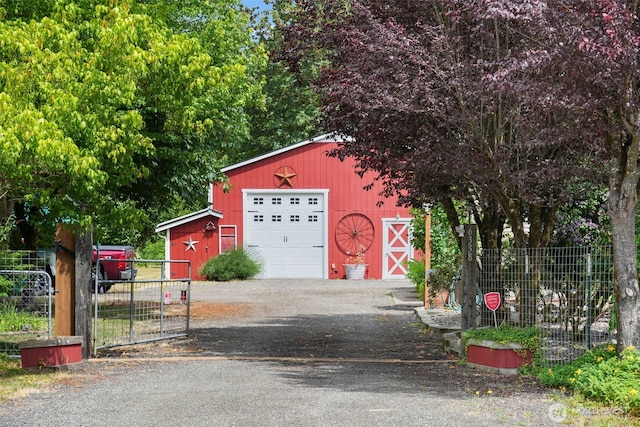 6338 Kirsop, Olympia, WA 98512 - view of front of home with an outbuilding, driveway, and a detached garage