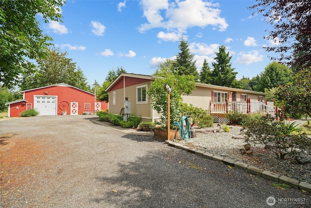 6338 Kirsop, Olympia, WA 98512 - single story home with a garage, an outbuilding, gravel driveway, and a deck