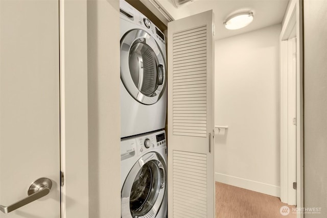 530 Broadway E Unit 130, Seattle, WA 98102 - laundry area with estacked washer and dryer and light carpet