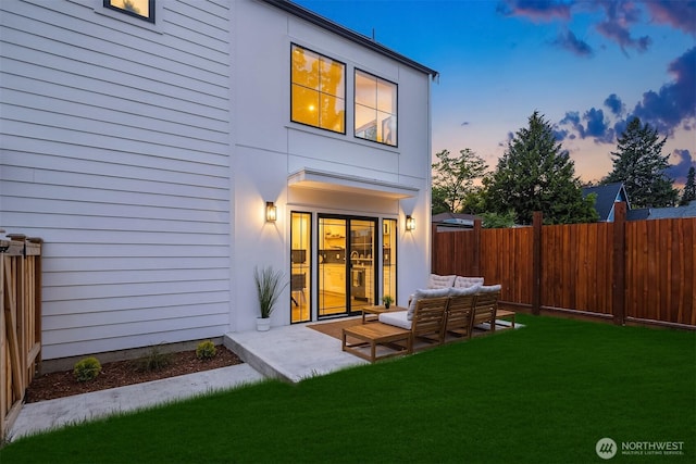 9224 36th Ave SW Unit 2, Seattle, WA 98126 - back of house at dusk featuring a patio area