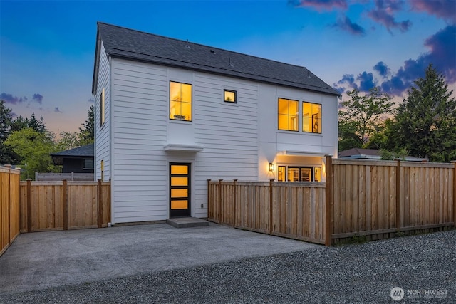 9224 36th Ave SW Unit 2, Seattle, WA 98126 - view of front of house with a patio and roof with shingles