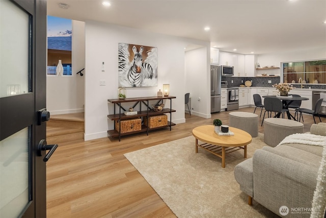 9224 36th Ave SW Unit 2, Seattle, WA 98126 - living area with light wood-type flooring and recessed lighting