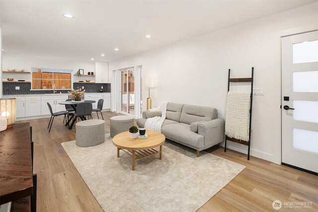9224 36th Ave SW Unit 2, Seattle, WA 98126 - living area featuring light wood-style flooring and recessed lighting