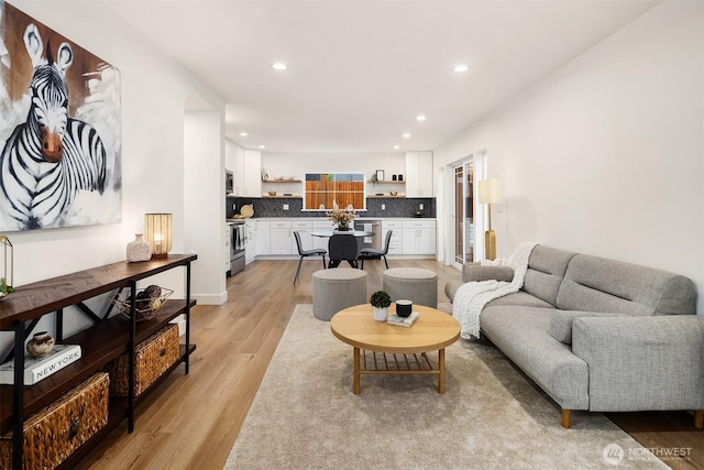 9224 36th Ave SW Unit 2, Seattle, WA 98126 - living area featuring light wood-style floors and recessed lighting