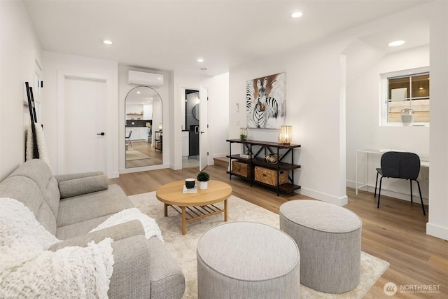 9224 36th Ave SW Unit 2, Seattle, WA 98126 - living area featuring a wall unit AC, light wood-type flooring, and recessed lighting