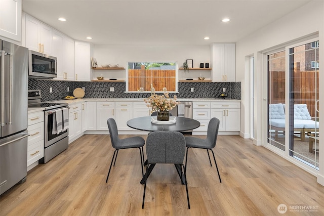 9224 36th Ave SW Unit 2, Seattle, WA 98126 - kitchen featuring stainless steel appliances, open shelves, white cabinets, and recessed lighting