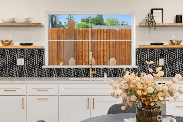 9224 36th Ave SW Unit 2, Seattle, WA 98126 - kitchen with open shelves, light countertops, backsplash, and white cabinets