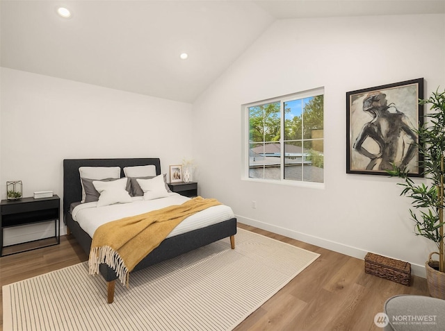 9224 36th Ave SW Unit 2, Seattle, WA 98126 - bedroom with vaulted ceiling, recessed lighting, and wood finished floors