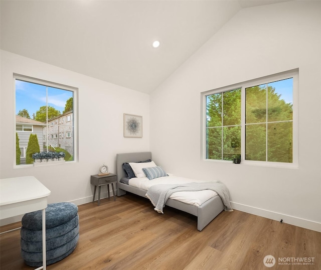 9224 36th Ave SW Unit 2, Seattle, WA 98126 - bedroom featuring multiple windows, lofted ceiling, light wood finished floors, and recessed lighting