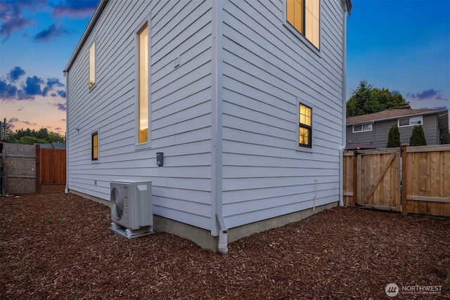 9224 36th Ave SW Unit 2, Seattle, WA 98126 - view of home's exterior with an ac unit and a gate