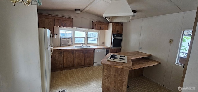 211 Pace Dr Unit 17, East Wenatchee, WA 98802 - kitchen with white appliances, under cabinet range hood, lofted ceiling, light floors, and brown cabinets