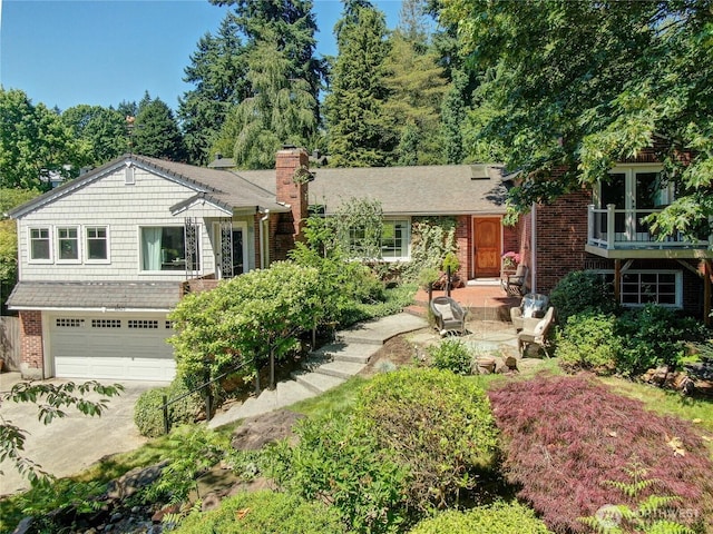 16525 39th Ave NE, Lake Forest Park, WA 98155 - view of front of home featuring a chimney, driveway, an attached garage, and brick siding