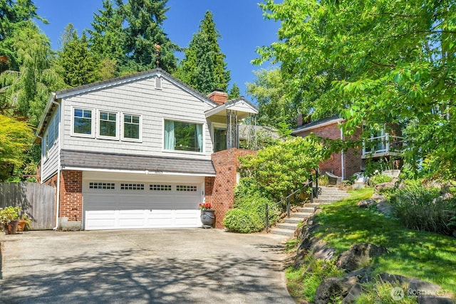 16525 39th Ave NE, Lake Forest Park, WA 98155 - view of front of home featuring driveway, an attached garage, stairs, a chimney, and brick siding