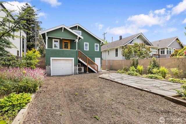 6427 Flora Ave S, Seattle, WA 98108 - view of front of property with stairs, a garage, and driveway