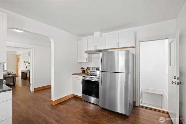 6427 Flora Ave S, Seattle, WA 98108 - kitchen featuring appliances with stainless steel finishes, under cabinet range hood, dark countertops, white cabinets, and dark wood finished floors