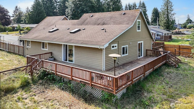 6621 125th Street Ct E, Puyallup, WA 98373 - back of house with roof with shingles and a deck