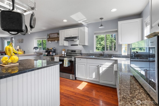 6621 125th Street Ct E, Puyallup, WA 98373 - kitchen featuring stainless steel electric range oven, light wood-type flooring, white cabinets, under cabinet range hood, and recessed lighting