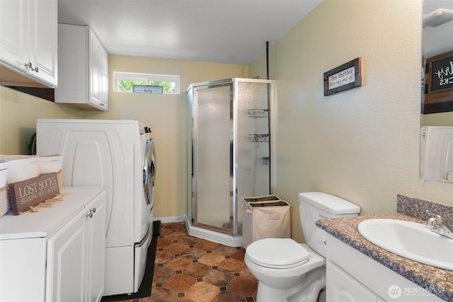 6621 125th Street Ct E, Puyallup, WA 98373 - full bathroom featuring washer / clothes dryer, vanity, and a shower stall
