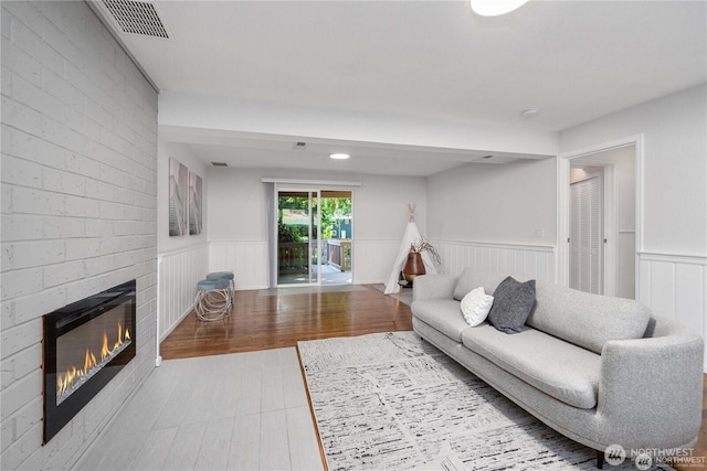 20873 2nd Pl SW, Normandy Park, WA 98166 - living room featuring a fireplace and wainscoting