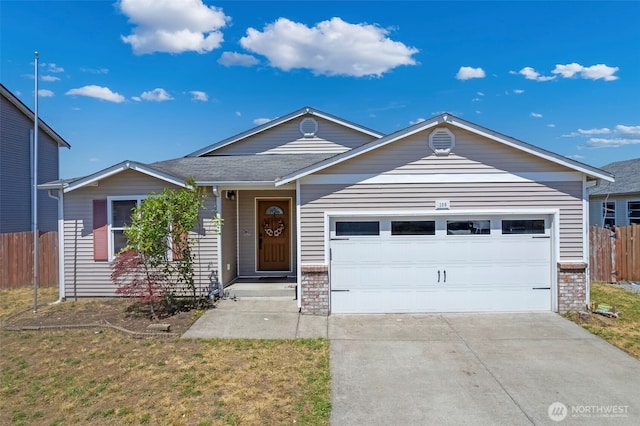 109 Nelsen St NE, Orting, WA 98360 - single story home with a garage, driveway, and brick siding