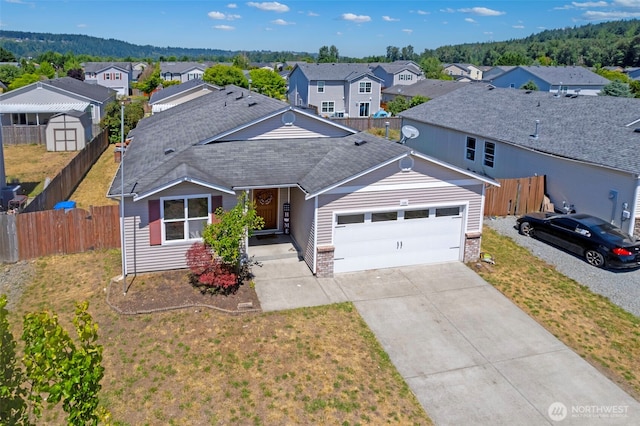 109 Nelsen St NE, Orting, WA 98360 - view of front of home with a residential view, an attached garage, driveway, a shingled roof, and brick siding