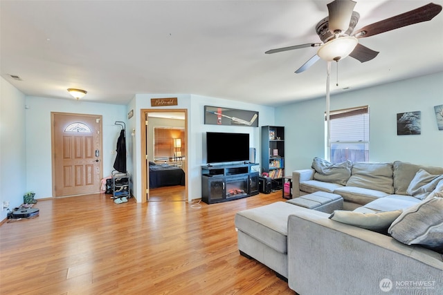 109 Nelsen St NE, Orting, WA 98360 - living area featuring light wood-style flooring and ceiling fan