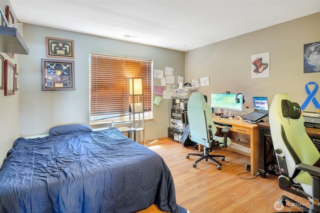 109 Nelsen St NE, Orting, WA 98360 - bedroom featuring wood finished floors and an office area
