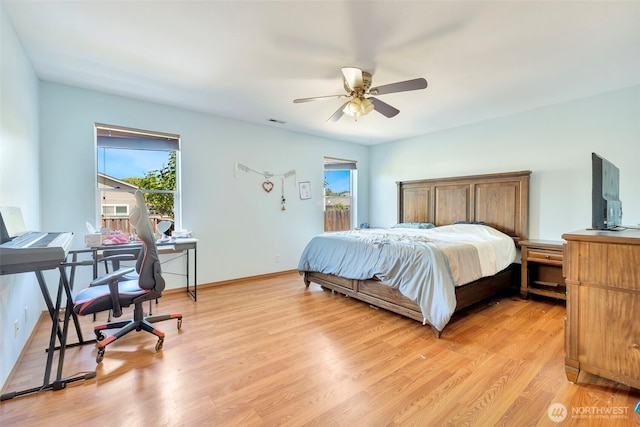 109 Nelsen St NE, Orting, WA 98360 - bedroom featuring a desk, light wood-style floors, a ceiling fan, and access to outside