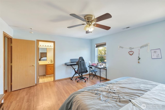 109 Nelsen St NE, Orting, WA 98360 - bedroom featuring light wood-style flooring, connected bathroom, and a ceiling fan