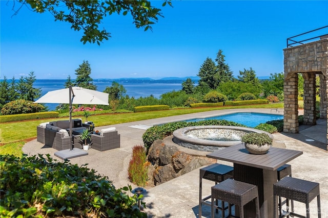 6411 View St NE, Tacoma, WA 98422 - swimming pool featuring a patio, a water view, and an outdoor living space