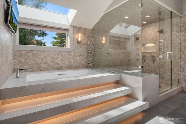 6411 View St NE, Tacoma, WA 98422 - full bath with a bath, tile walls, a shower stall, a skylight, and tile patterned flooring