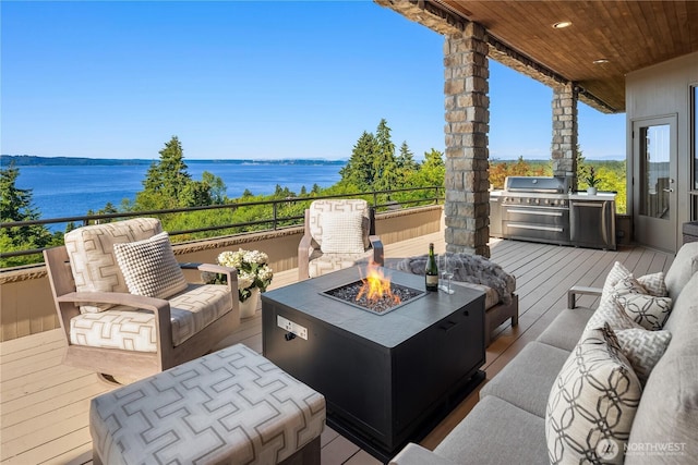 6411 View St NE, Tacoma, WA 98422 - wooden terrace with area for grilling, a water view, and an outdoor living space with a fire pit